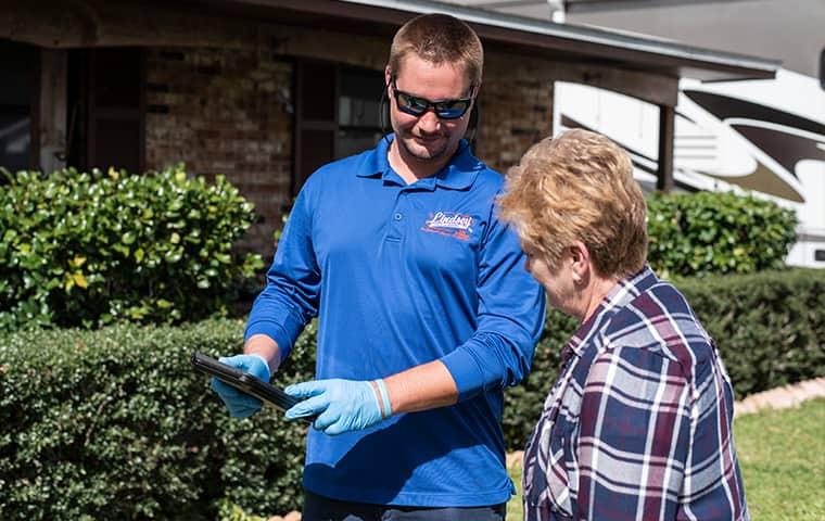 technician speaking to homeowner