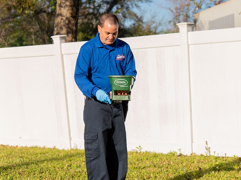 a technician performing an exterior treatment in jacksonville florida