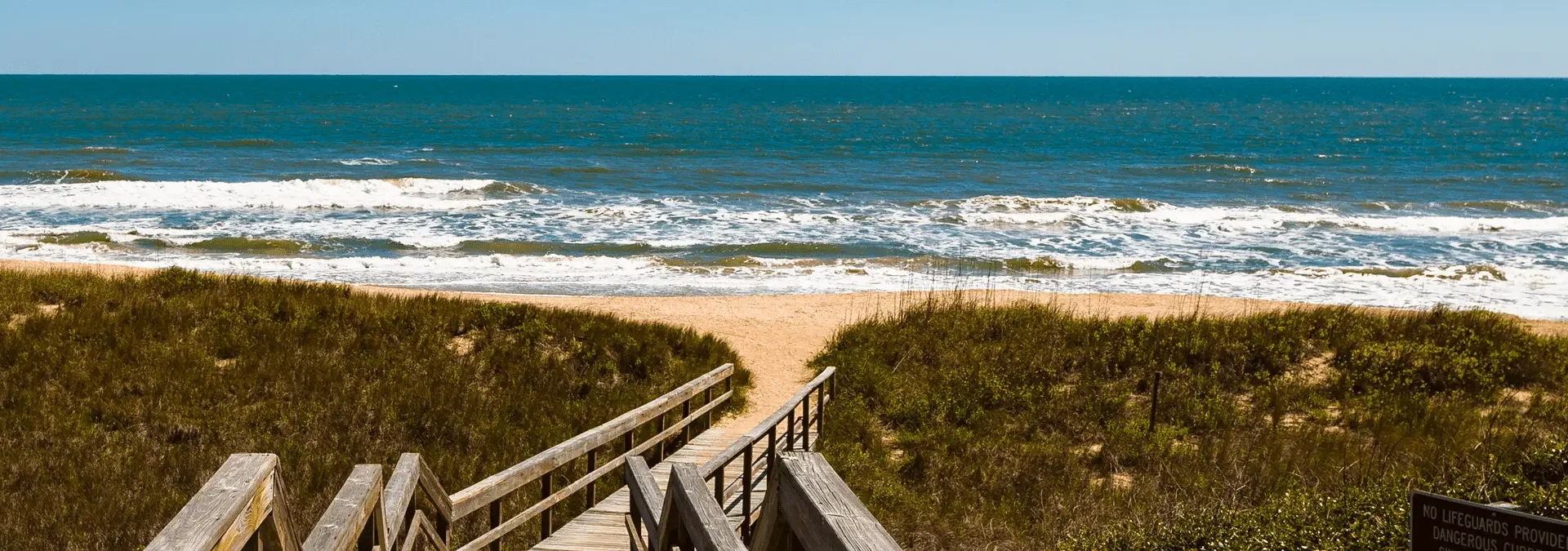 a walkway leading to the ocean in ponte vedra beach florida