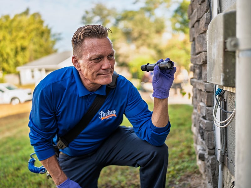 exterminator inspecting jacksonville home