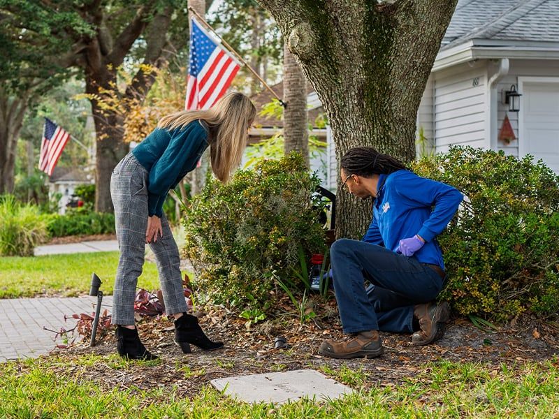 pest pro pointing out mosquito resting site