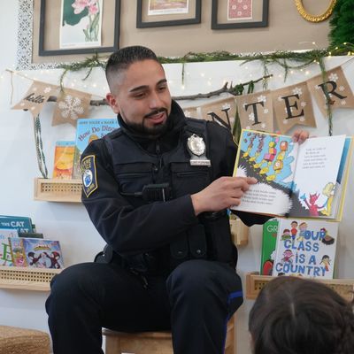 officer reading to kids