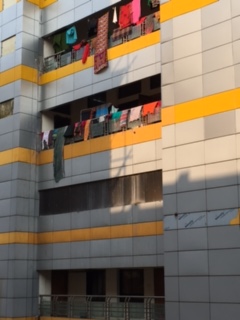 Exterior of cancer wards - patients must bring all their own supplies, and families wash items and hang them to dry outside.