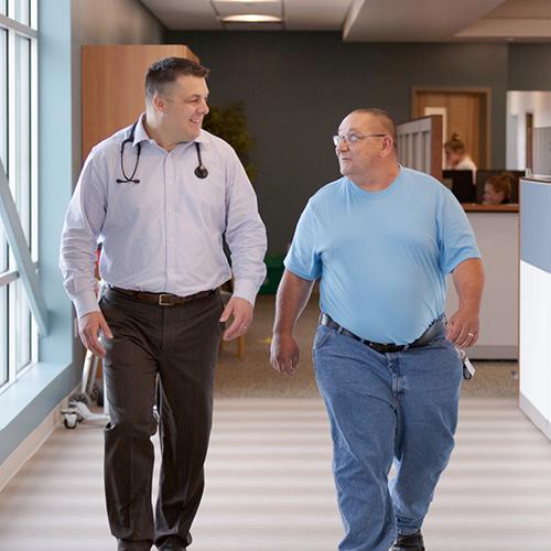 Doctor and patient walking