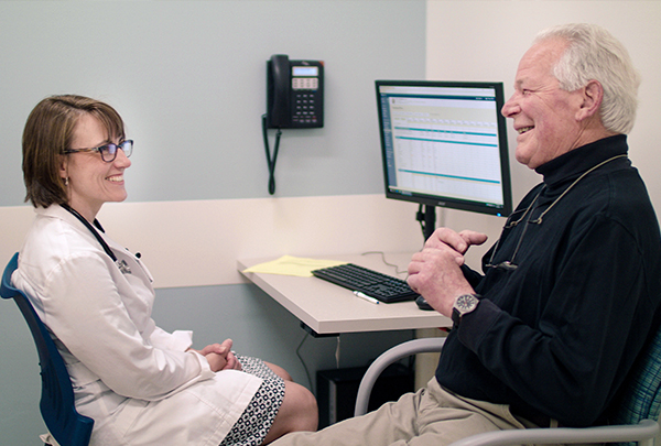 Roy speaking with his doctor