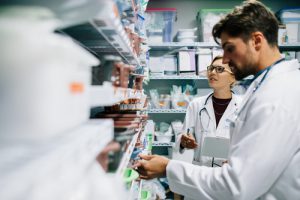 Pharmacist looking at medicines