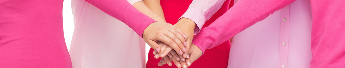 Women putting hands on top of one another