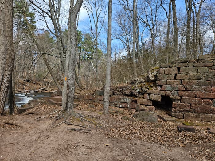 a brick building ruins next to the river (Credit: Laura Kelly)