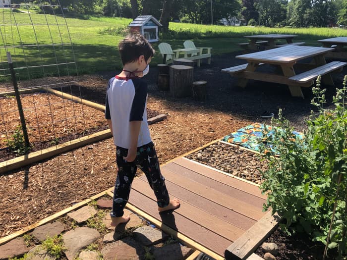a child exploring the sensory garden (Credit: Linda Anderson)