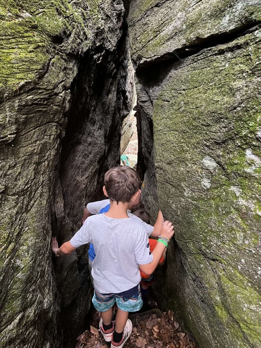 Hiking through a rock formation on Chatfield Trail (Credit: Brian Carroll)