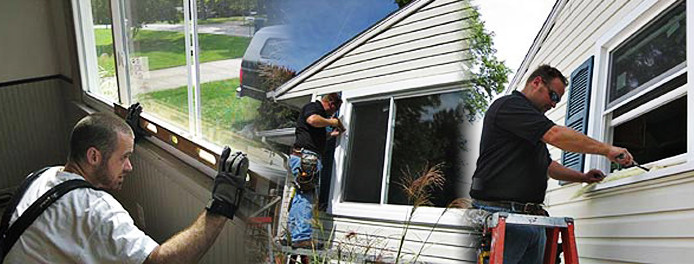 technicians installing new windows in a home in cleveland