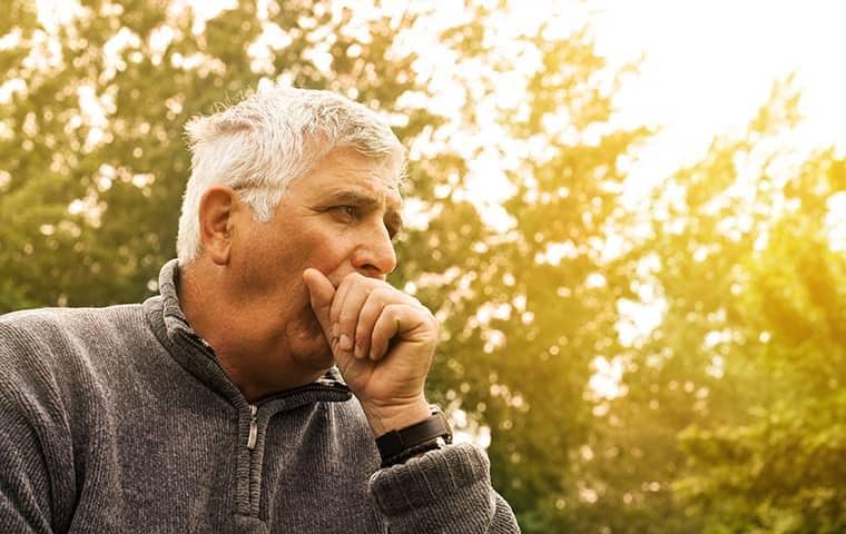 elderly man coughing