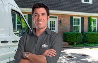 technician standing in front of a van