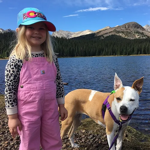 sunny with little girl by lake