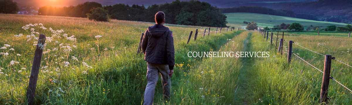 A man walks through a field. Catholic Charities' Counseling Services offer hope for improved quality of life.