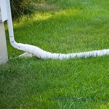 down spout directing water away from building