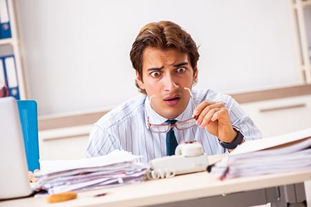 businessman working at home sees a cockroach