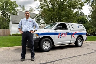 technician in front of house