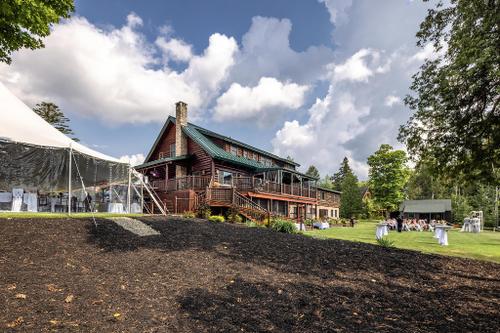 Event tent, Lodge and a wedding on the lawn