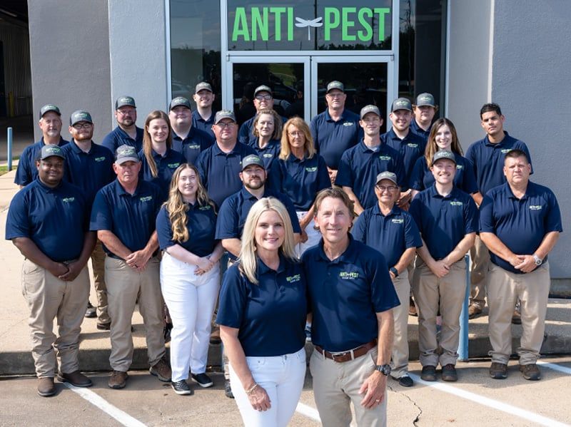 anti-pest employee photo in front of office