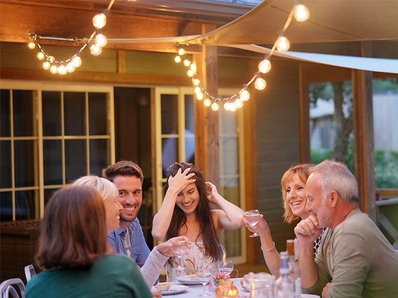 friends enjoying outdoor living space without mosquitoes