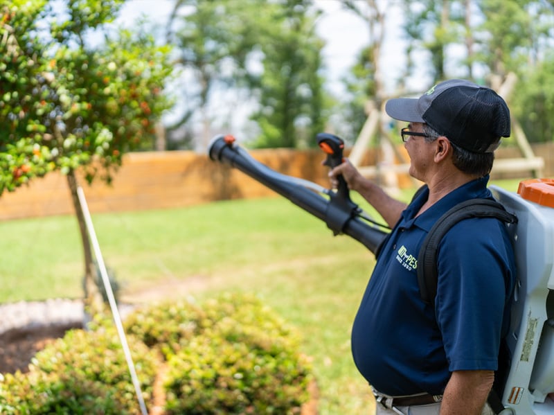 mosquito control pro treating yard for mosquitoes