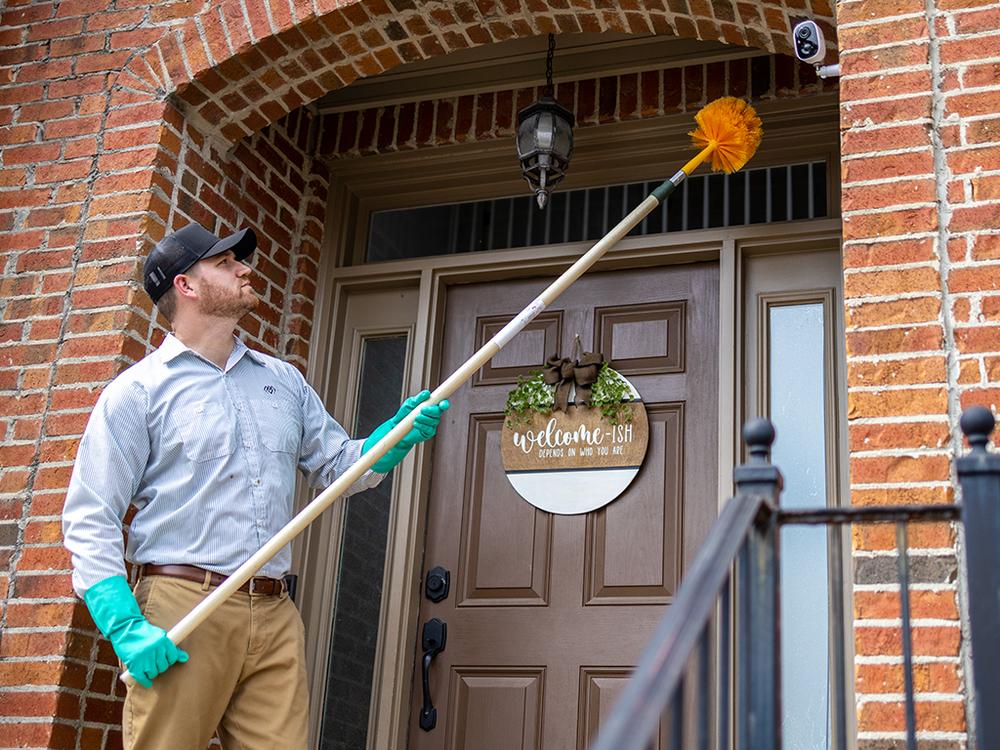 exterminator treating home for pests