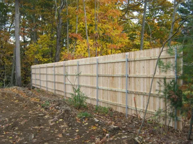 8' Stockade with Pressure Treated Rails and Steel Posts