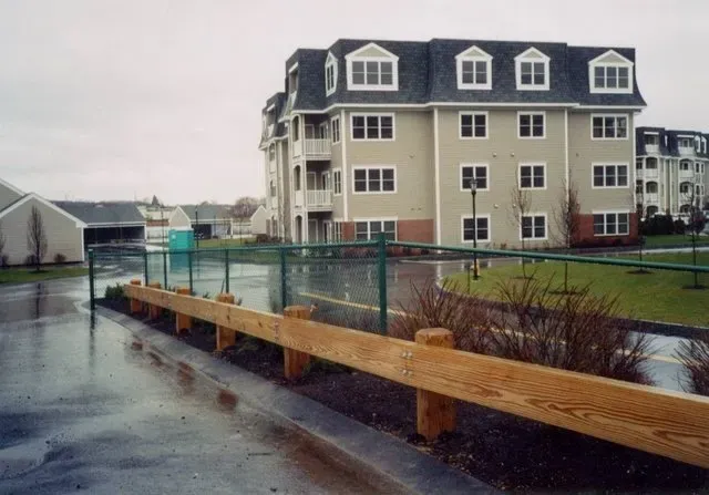 Wood Guardrail Face Mounted onto Posts with Chamfered Tops