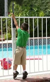 A child attempting to access a pool