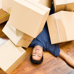 image of a man with moving boxes