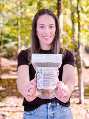 Our owner, Ashley, with our newest product: Chaga Tea Chunks (6oz).