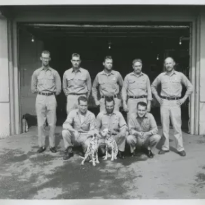 Black and White Photo people with puppies