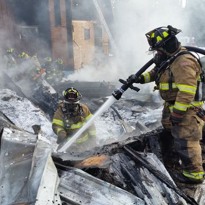 Firefighters spraying water