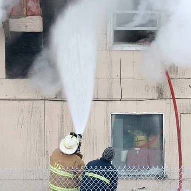 Firefighters spraying water