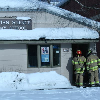 Firefighters in doorway of school