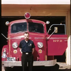 Person standing in front of Firetruck