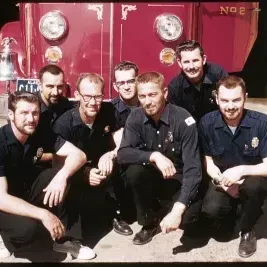 people posing in front of Firetruck