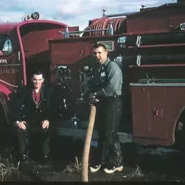 People in front of a Firetruck