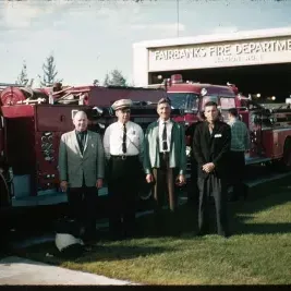 People in front of a Firetruck