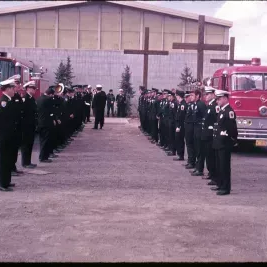 People standing in front of Fire station
