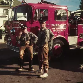 People in front of fire truck