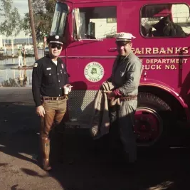 People in front of fire truck
