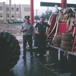 People in front of fire truck