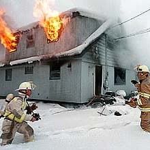 Two firefighters responding to fire