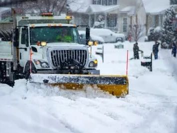 Snow removal truck plowing snow