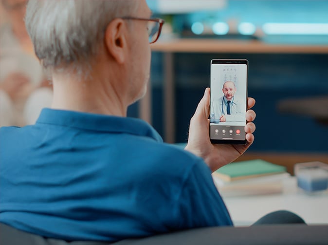 man consulting with a doctor virtually