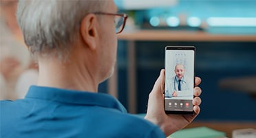 man consulting with a doctor virtually