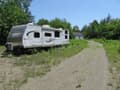 64.97 Acres with new 28x24 Garage & 33' camper