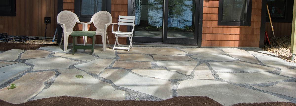 Stone patio with chairs